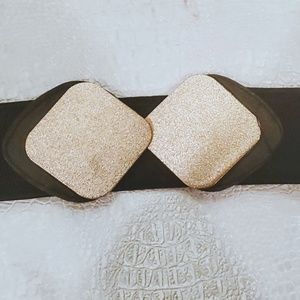 Black stretch belt with gold clasp closure